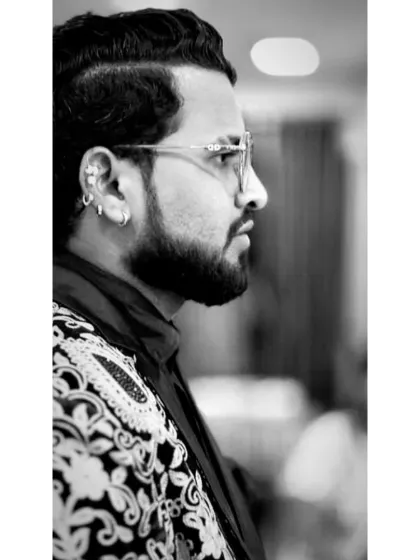 A thoughtful black and white profile. When a mystic does something, people call it a miracle. When a magician does the same thing, why do they call it sleight of hand? It's a question about the nature of art.