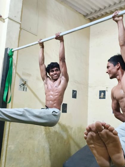 An L-sit hold, a foundational static move that builds incredible core and tricep strength.