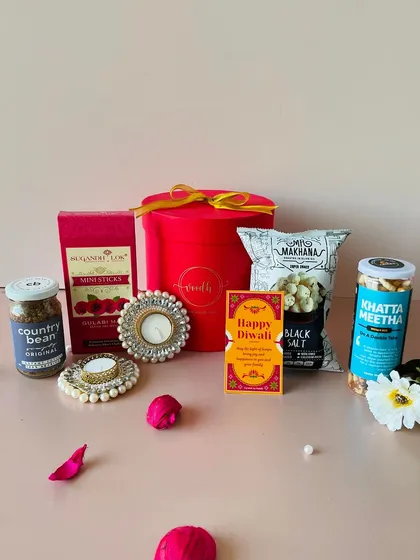 Another view of the round box hamper, showing the curated items arranged beautifully. It's a complete gift set that's ready to go.