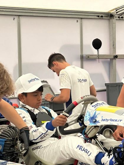 Our young driver gets settled into his kart at the Baby Race Summer Camp in Italy.