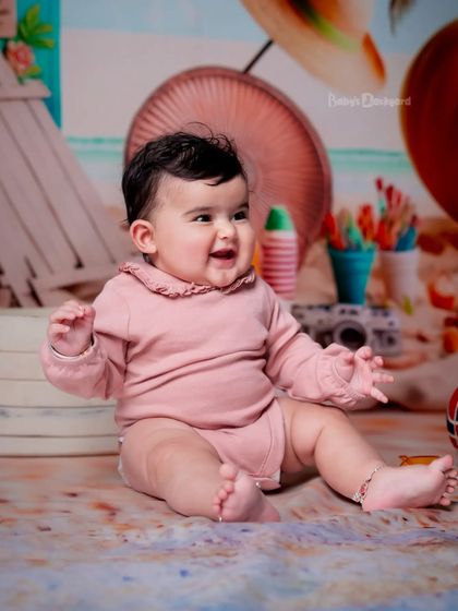 Sun, sand, and cuteness overload. Our beach theme studio setup is perfect for a summer vibe.