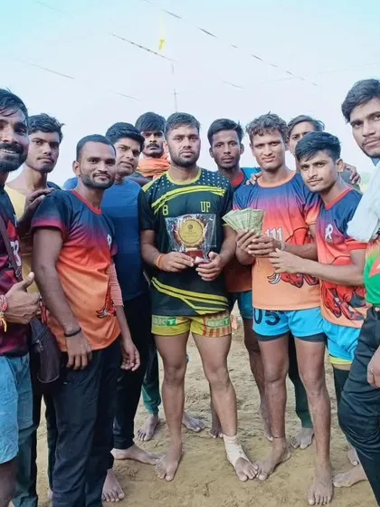 Another shot of the team with their trophy and prize money after winning the tournament in Etah.