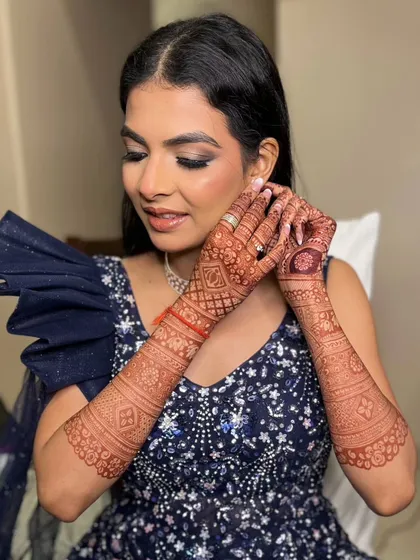 The final touches for her reception night. The smokey eye makeup is perfectly blended to create a captivating gaze.
