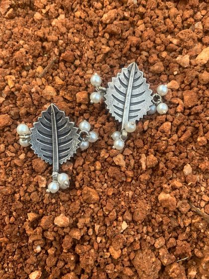 The leaf studs with pearls, a perfect example of how nature inspires my work. These were a limited edition design that you all loved.