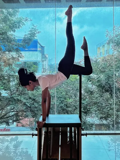We help you discover a level of strength you never thought possible. This advanced handstand variation on the Wunda Chair requires immense core control, balance, and upper body strength, all principles we build progressively and safely in our training.