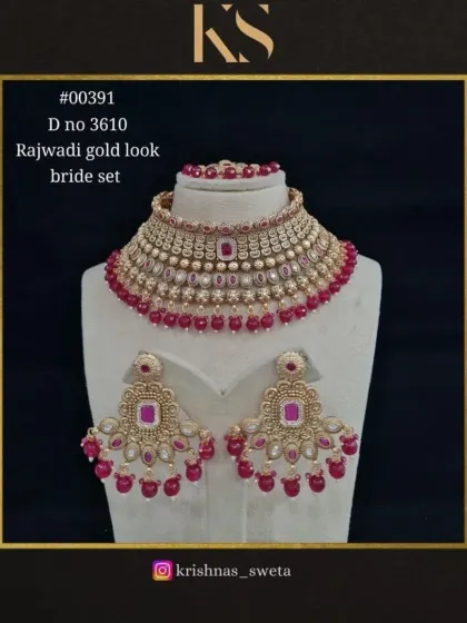 Our exclusive Rajwadi bridal set in a classic ruby red. This is a timeless choice for a traditional wedding ceremony, offering a rich and royal aesthetic.