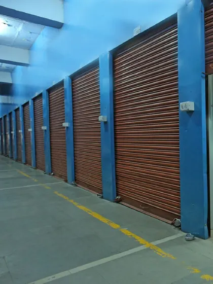 Our facilities feature a variety of unit types to match your specific needs. This row of private, roll-up shutter units demonstrates one of our popular options for storing business inventory, equipment, or office furniture securely.