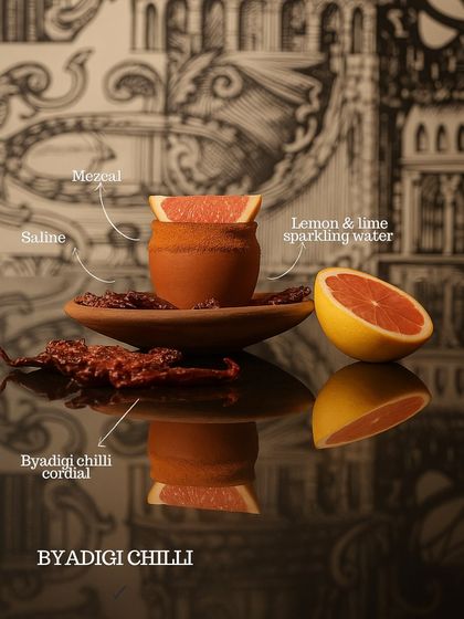 The Byadgi Chilli cocktail, a unique blend of mezcal, saline, Byadgi chilli cordial, and sparkling water. A perfect example of how we mix South Indian ingredients with global spirits.