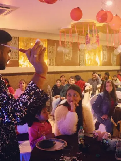 This is what it's all about. Performing close-up magic for a family at a birthday dinner. The gasps and surprised looks are why we do what we do. Our parlor and roaming magic is perfect for smaller, more intimate gatherings.