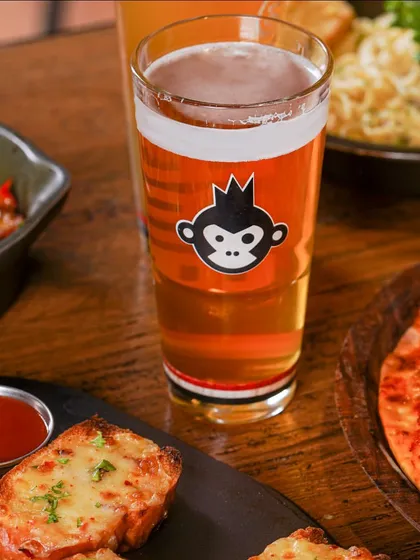 We created a full dining scene for Bira91, pairing their beer with delicious food like pizza and garlic bread. This helps customers see the product as part of a complete, enjoyable experience.