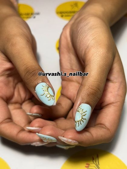 A celestial-inspired set with a dreamy pastel palette. I hand-painted sun motifs, stars, and swirls, combining different designs for a whimsical and artistic manicure.