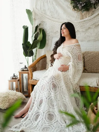 A beautiful example of a natural light, boho-chic setup. Learn to use lace dresses, macrame backdrops, and indoor plants to create a relaxed and earthy atmosphere.