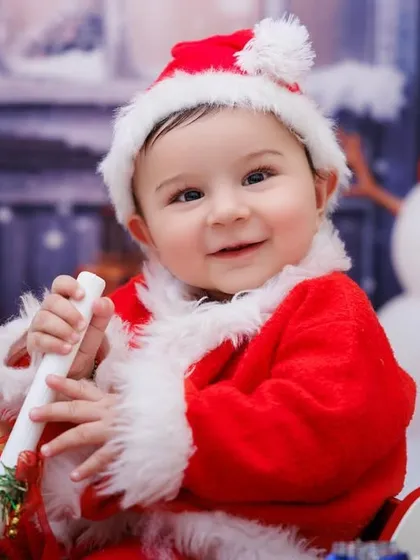 The magic of 'My First Christmas'! This little Santa's happy smile in our winter wonderland setup is what holiday mini-sessions are all about: capturing that festive excitement in a picture you'll look back on for years.