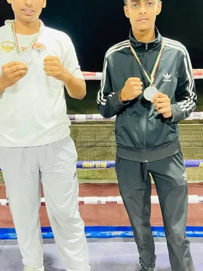 Two of my fighters after winning silver at the state school games. They fought hard and earned their place on the podium.