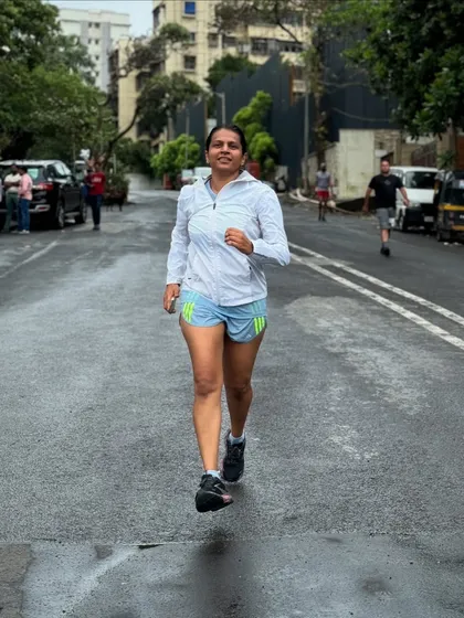 An athlete in full flight during a Sunday hill run. The focus is on maintaining good form even when tired.