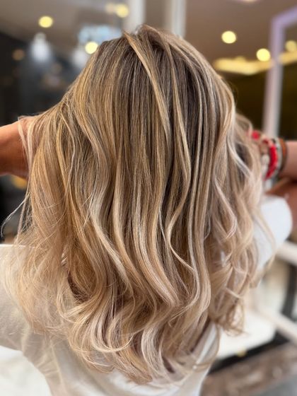 A close-up of the platinum blond hair color blend, showing the beautiful, cool-toned highlights.