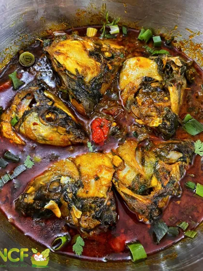 'Nga makok' or Rohu fish head curry. This is considered one of the yummiest parts of the fish, cooked in a thick, spicy gravy.