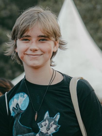 A candid, happy portrait of a visitor at Comic Con. It's not just about the cosplayers; it's about capturing the joy of everyone attending the event.