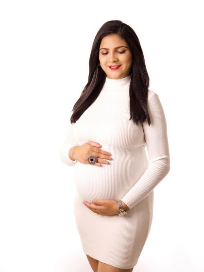 A serene solo portrait in a simple white ribbed dress. This is a perfect example of how minimalist styling can create a beautiful and timeless image.