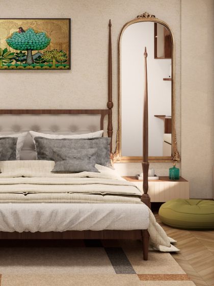 This bedroom features a classic four-poster bed and a beautiful piece of Gond art, blending traditional Indian elements with a clean, modern aesthetic.