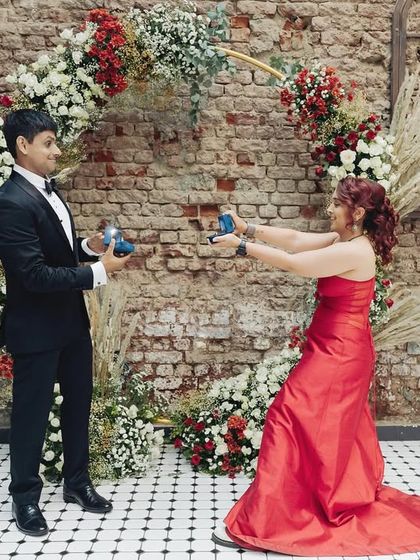 A playful and quirky moment during the ring exchange, capturing the fun-loving personalities of the couple.