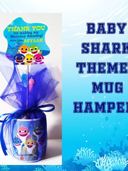 This Baby Shark mug hamper is perfect for toddler birthdays. It includes a character mug and themed stationery, wrapped in blue netting with a custom tag.