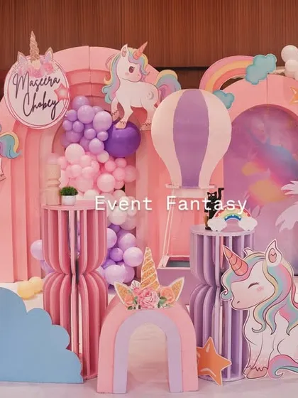 A magical unicorn-themed birthday party for Maseera. The backdrop is a fantasy world of pink and purple arches, clouds, rainbows, and of course, plenty of enchanting unicorns.