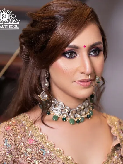 A close-up of a bold and beautiful party makeup look. We focused on a dramatic smokey eye and a perfectly sculpted hairstyle to create a head-turning appearance for our client's special event.