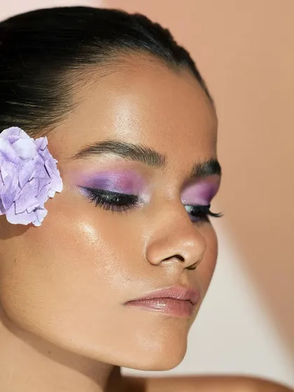 Adding a flower that matches the eyeshadow color emphasizes the inspiration behind the look. This shows how we can draw from anything to create something beautiful.