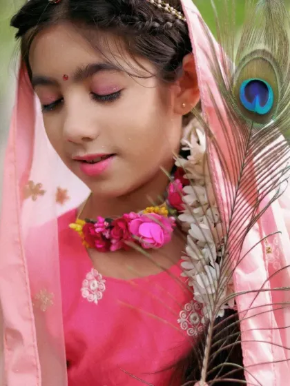 A serene portrait for a Radha-themed shoot. We use soft lighting and beautiful floral accessories to highlight the divine and gentle look for this special cultural photoshoot.