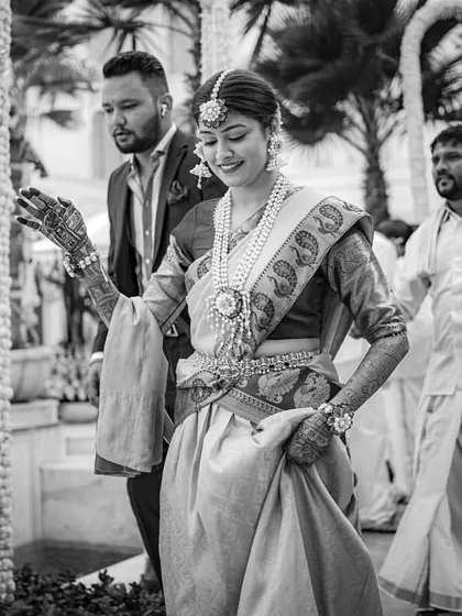 A black and white shot of the bride's entry, capturing a timeless and graceful moment.