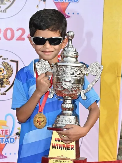 Cool, calm, and a champion. One of our U7 players enjoying the victory at the Chote Ustad Trophy.
