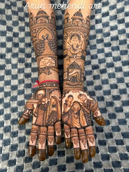 A design that includes family portraits, Ganesha, peacocks, and a special message from the bride.