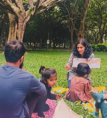 A series of photos from our 'Courage' themed session, showing different angles of the group and the beautiful, leafy surroundings of our storytelling spot.