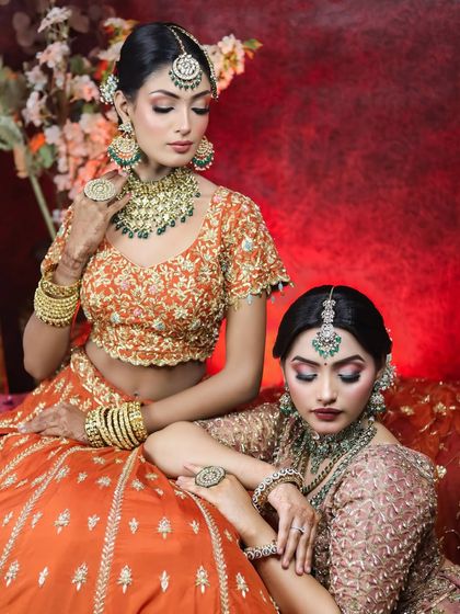 This photoshoot showcases two distinct but complementary bridal makeup looks. I used earthy tones and emerald green accents to create a cohesive and luxurious aesthetic, perfect for a high-fashion bridal editorial or for sisters getting ready together.