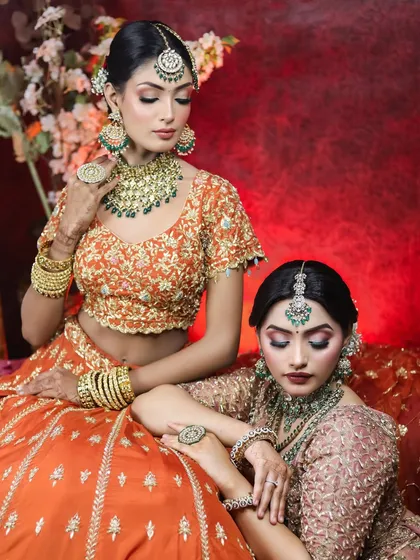 An artistic shot from our bridal editorial. The poses and makeup are styled to create a high-fashion narrative, showing our versatility beyond traditional client work.