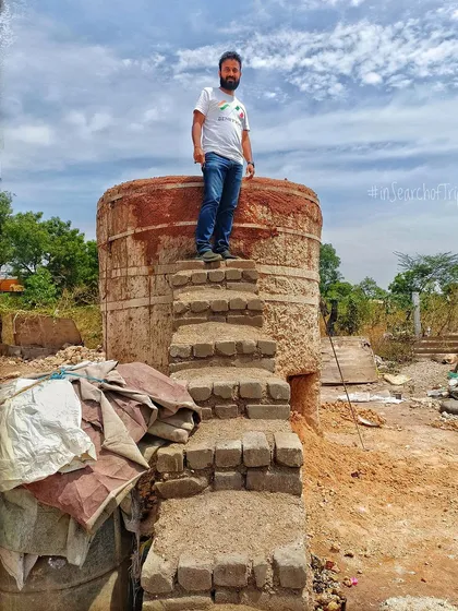One of our architects standing atop a traditional vertical lime kiln. Understanding how lime is produced, from burning the limestone to slaking it, is crucial to our expertise in using this ancient and versatile building material.