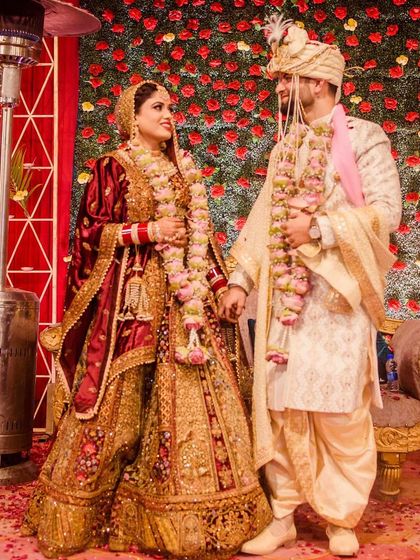A classic stage shot of the beautiful couple after their varmala ceremony.