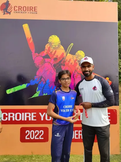 A player receiving an award for his performance in the match.