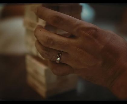 A close-up shot focusing on Rajkummar Rao's hand and the Tanishq ring. In jewelry campaigns, every detail counts, and the styling must complement without distracting from the product.