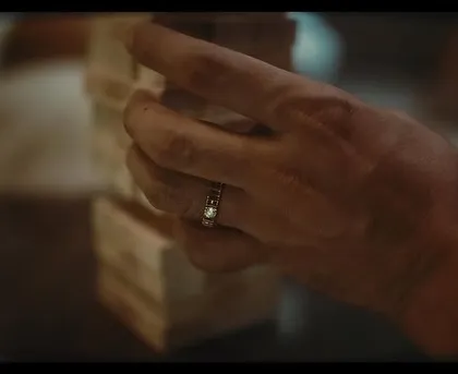 A close-up shot focusing on Rajkummar Rao's hand and the Tanishq ring. In jewelry campaigns, every detail counts, and the styling must complement without distracting from the product.