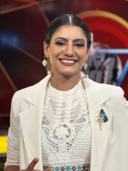 A bright smile for the camera. Being a TV personality requires an approachable and engaging demeanor, which I bring to all my professional interactions.