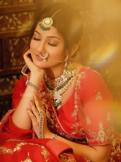 A dreamy bridal portrait with a golden flare effect, giving the image a warm, magical quality.