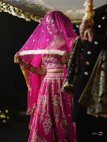 A bride performing a wedding ritual. This close-up shot focuses on the details of the ceremony and the bride's serene expression, highlighting the cultural significance of the moment.