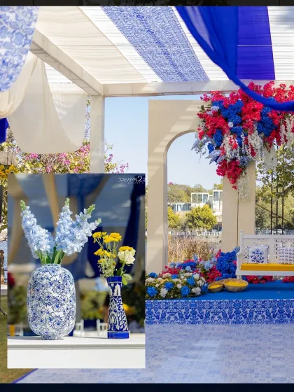 The outdoor Haldi space was draped in flowing white and blue fabrics. We used blue and white printed vases and fresh flowers to continue the cohesive color story.