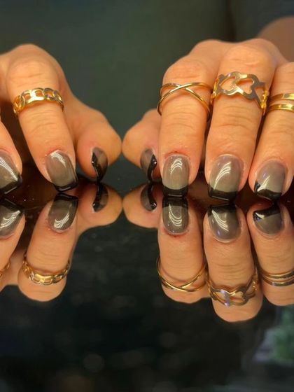 A full view of the chic grey and black-tipped nails.
