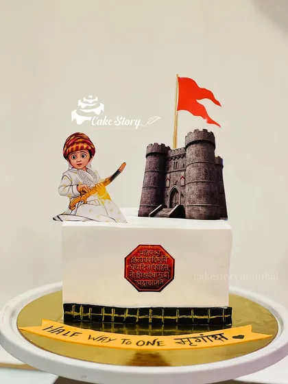 A square cake design for a half-birthday, also celebrating our Maratha heritage. It features a young Shivaji Maharaj and his fort, perfect for introducing little ones to our great history.