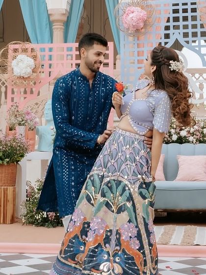 A sweet, romantic pose during a daytime couple's dance. The colorful decor and natural light make for a beautiful setting, and we choreograph moments like these to feel natural and full of love.