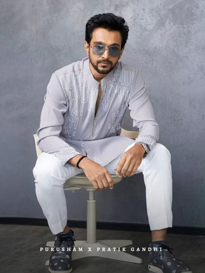 When style meets smolder. Pratik Gandhi serves looks that cannot be ignored in this contemporary grey kurta set, a perfect example of modern Indian menswear.
