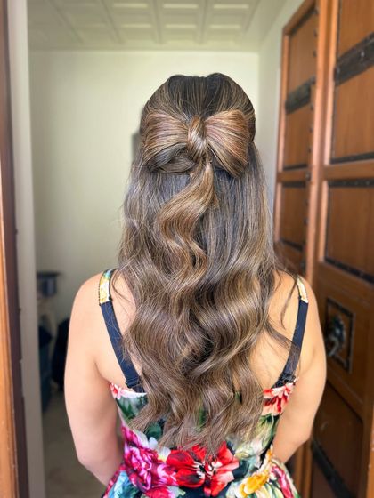 The full back view of the hair bow hairstyle.